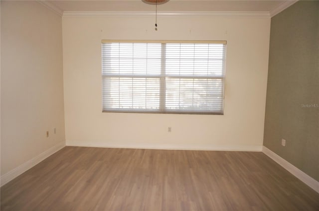 unfurnished room with wood-type flooring and crown molding