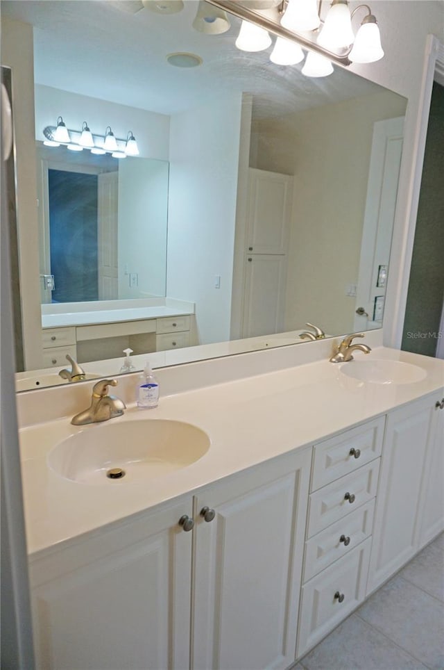 bathroom with tile patterned flooring and vanity