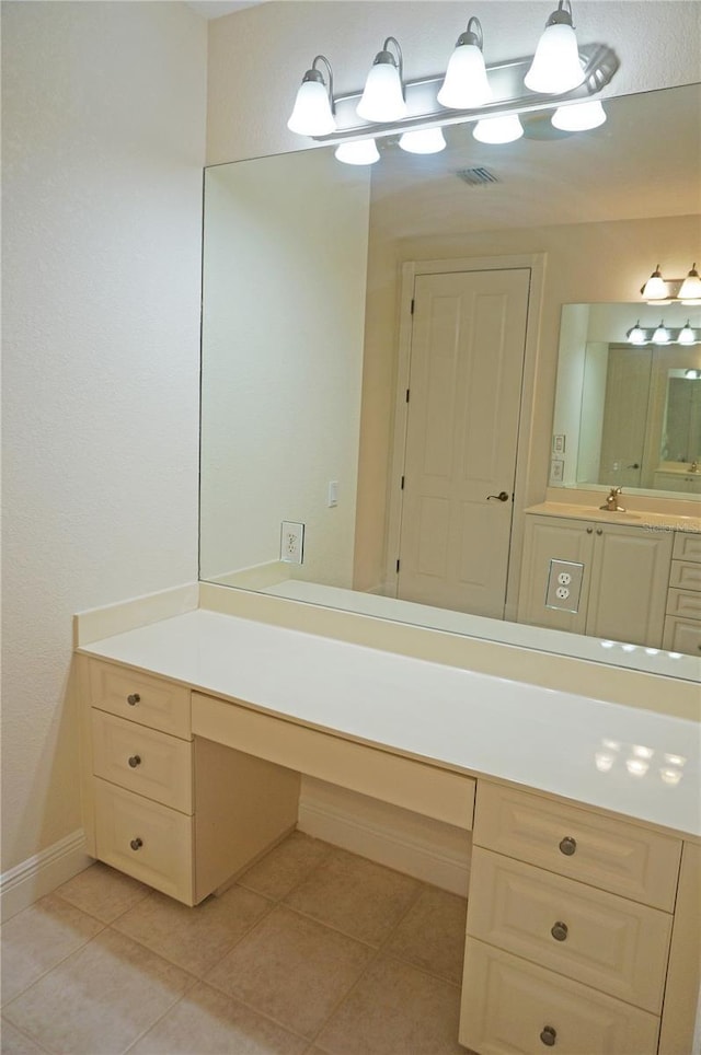 bathroom with tile patterned flooring and vanity