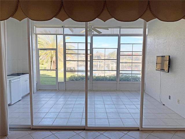 entryway with plenty of natural light and light tile patterned flooring