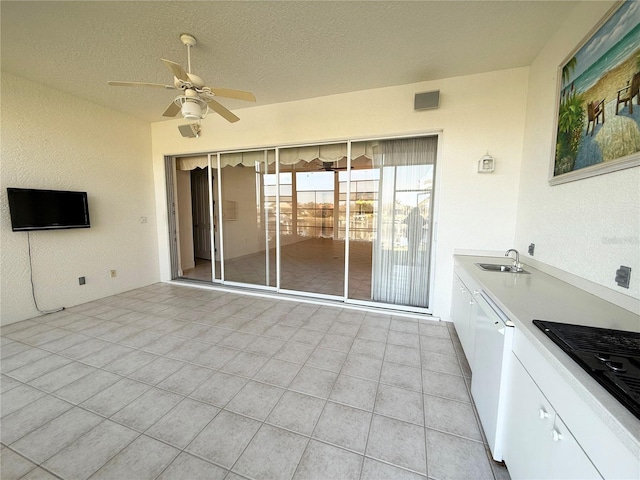 view of patio / terrace with ceiling fan and sink