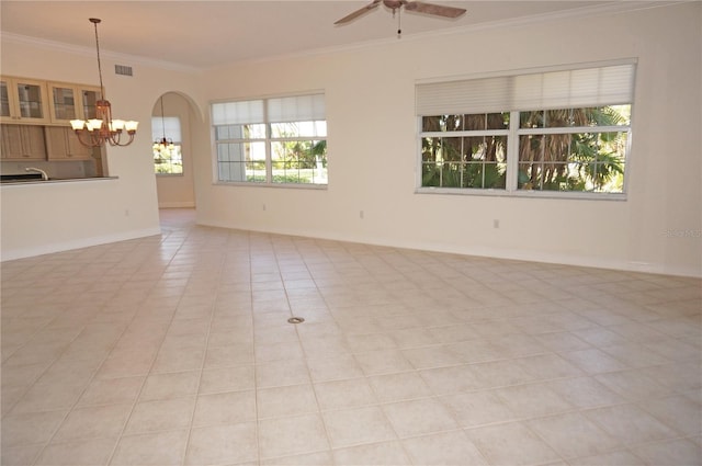 unfurnished room featuring crown molding, light tile patterned flooring, and ceiling fan with notable chandelier