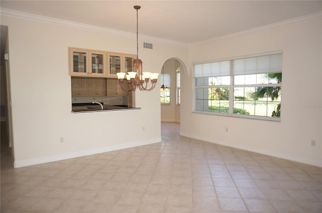 interior space featuring ornamental molding, sink, light tile patterned floors, and an inviting chandelier