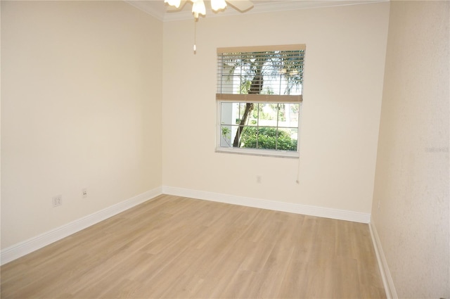 unfurnished room with light hardwood / wood-style floors, ceiling fan, and crown molding