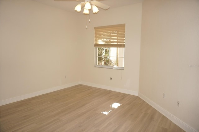 empty room with light hardwood / wood-style floors and ceiling fan