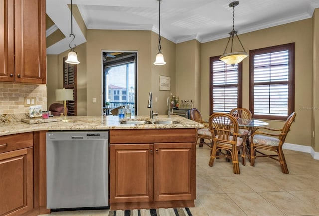 kitchen with pendant lighting, dishwasher, crown molding, sink, and decorative backsplash