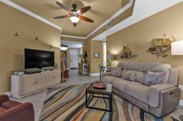 tiled living room featuring ceiling fan and crown molding