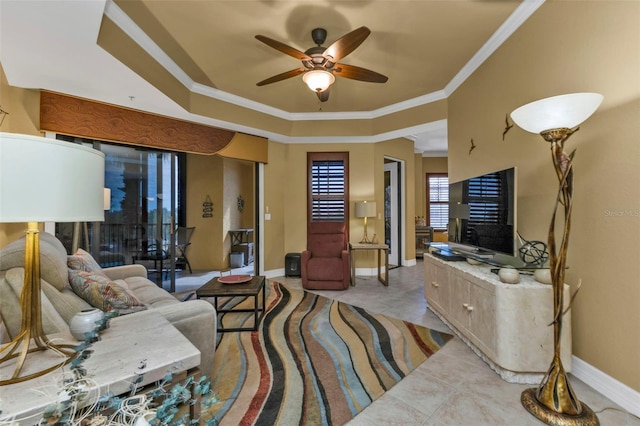 living room featuring ceiling fan and crown molding