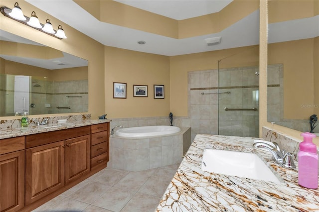 bathroom featuring tile patterned flooring, vanity, and independent shower and bath