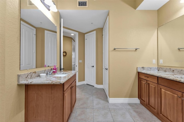 bathroom featuring tile patterned floors and vanity