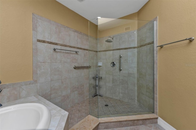 bathroom featuring separate shower and tub and sink