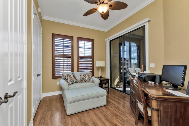 office space featuring ceiling fan, crown molding, and light hardwood / wood-style flooring