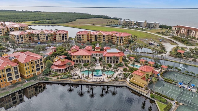 birds eye view of property featuring a water view