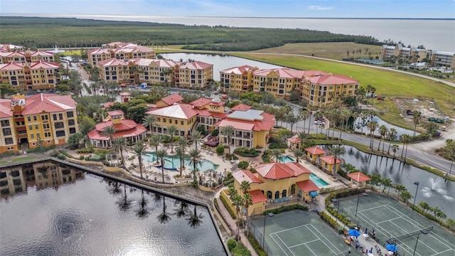 birds eye view of property featuring a water view