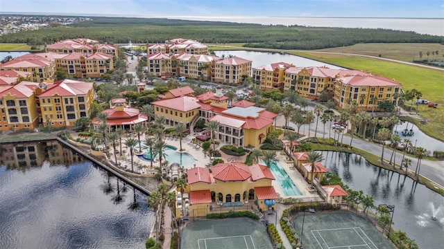 birds eye view of property with a water view