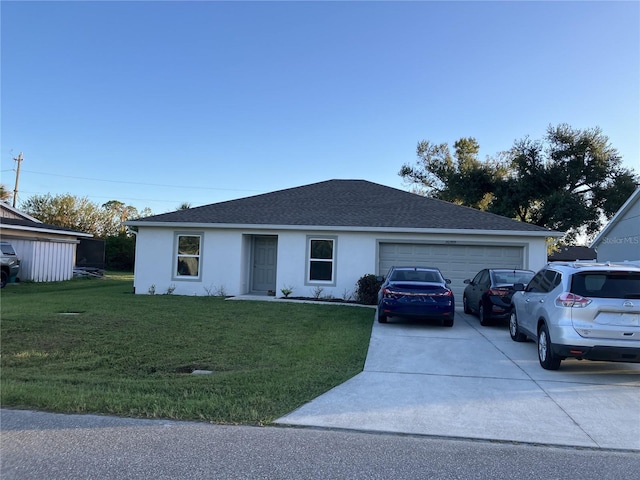 single story home featuring a garage and a front yard