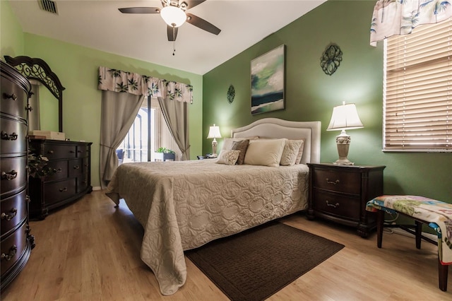 bedroom with ceiling fan and light wood-type flooring