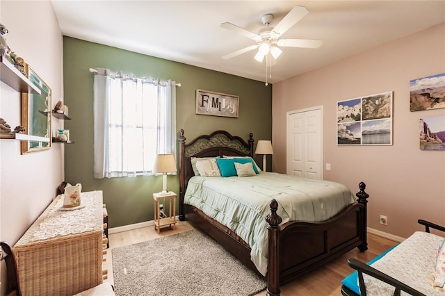 bedroom featuring a closet, ceiling fan, and hardwood / wood-style floors