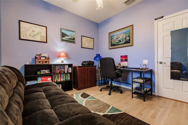 office with ceiling fan and light wood-type flooring