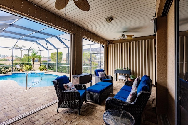 view of patio / terrace with a lanai, ceiling fan, and an outdoor hangout area