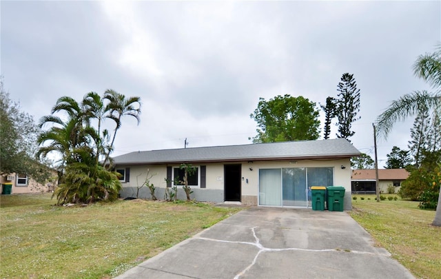 11332 8th Ave, Punta Gorda, FL 33955 - ranch-style house with stucco siding and a front yard