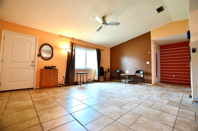 interior space with ceiling fan and lofted ceiling