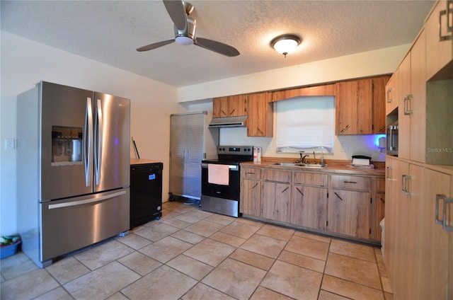 kitchen featuring a textured ceiling, ceiling fan, sink, and appliances with stainless steel finishes