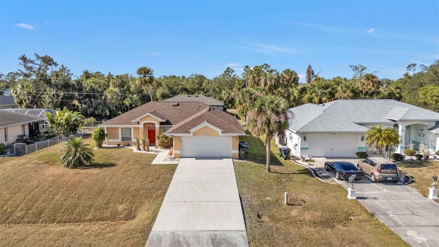 ranch-style house featuring a garage and a front lawn