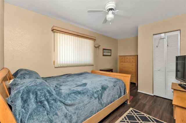 bedroom with ceiling fan, dark hardwood / wood-style flooring, and a closet