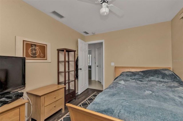 bedroom featuring ceiling fan and dark hardwood / wood-style floors