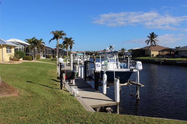 dock area featuring a yard and a water view