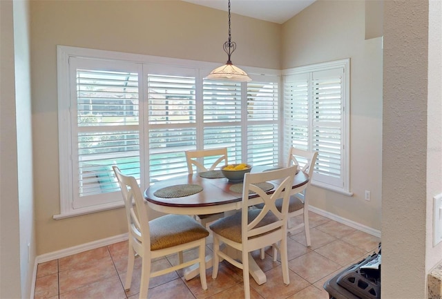 dining area featuring light tile patterned floors