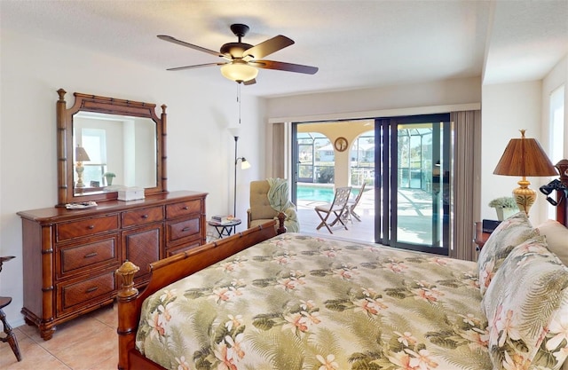 tiled bedroom with ceiling fan and access to exterior