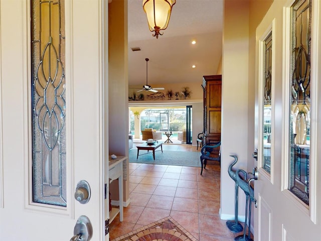 tiled entrance foyer with ceiling fan