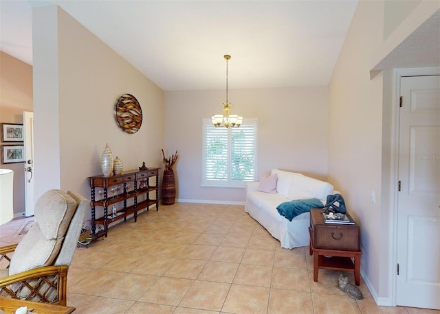 sitting room with a chandelier and light tile patterned flooring