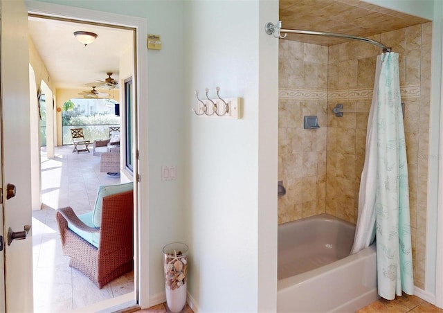 bathroom with tile patterned floors and shower / tub combo with curtain