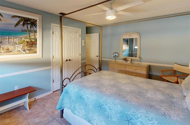 bedroom with ceiling fan and light tile patterned floors