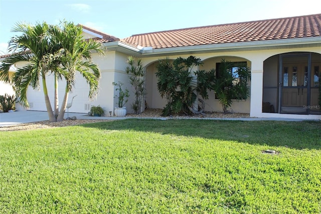 exterior space with a lawn and a garage