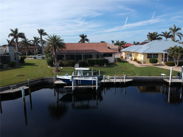 dock area featuring a yard and a water view