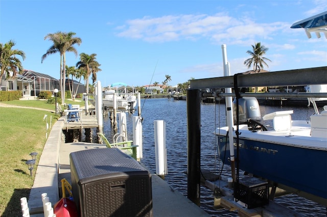 view of dock featuring a lawn and a water view