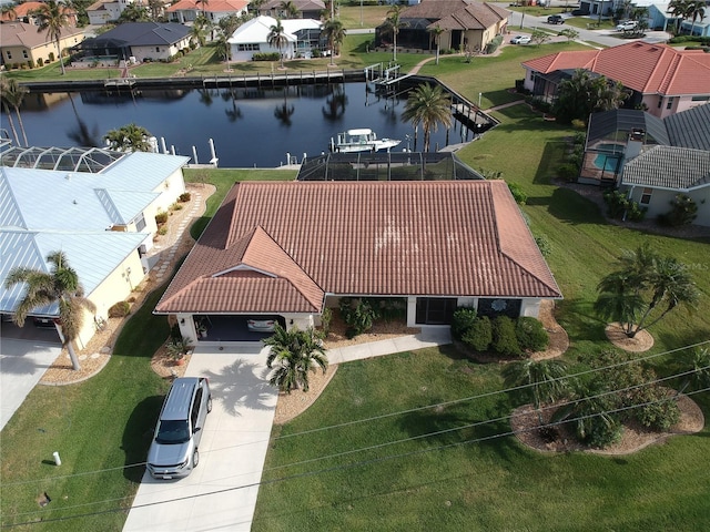 birds eye view of property with a water view