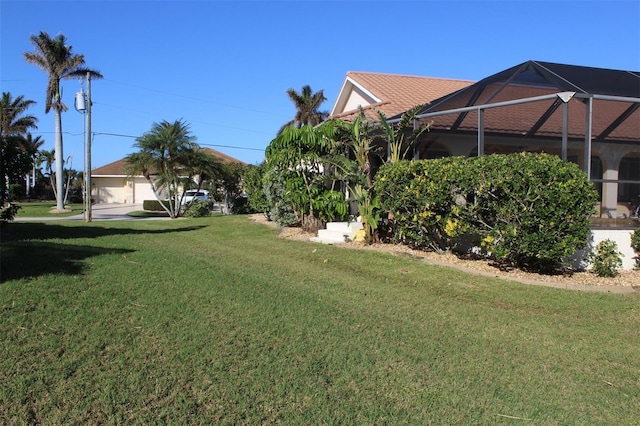 view of yard featuring a lanai