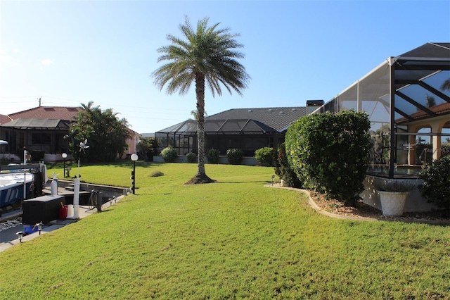 view of yard featuring a lanai