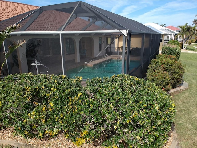 view of pool featuring a lanai and a patio