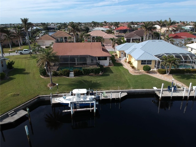 aerial view with a residential view and a water view