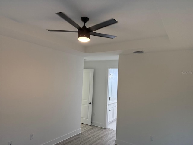 empty room featuring light hardwood / wood-style floors and ceiling fan