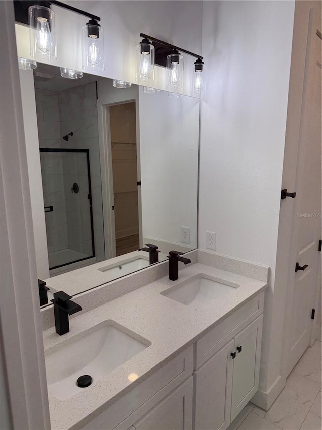 bathroom with vanity and an enclosed shower