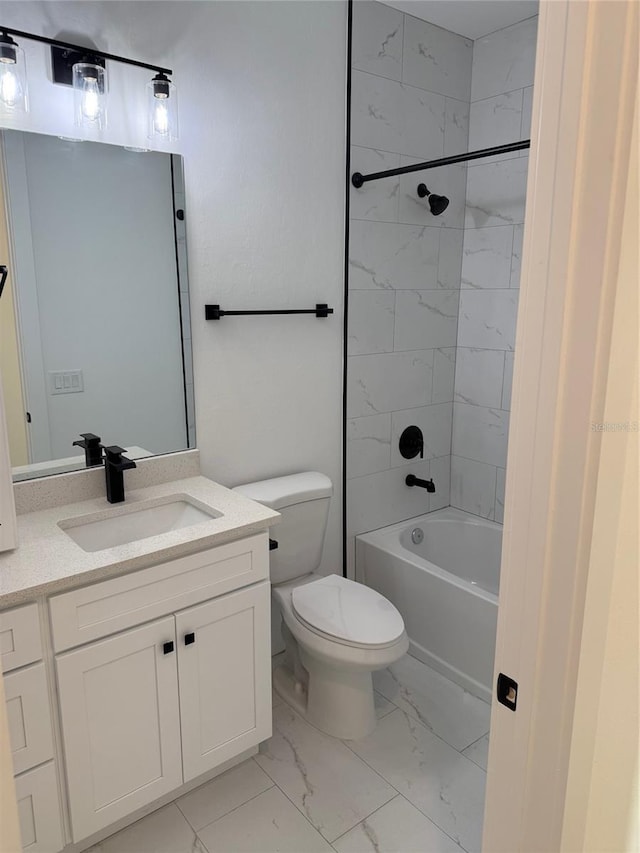 full bathroom featuring vanity, toilet, and tiled shower / bath