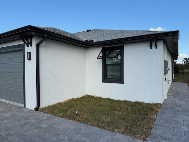 view of side of home with a garage