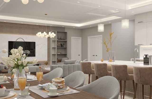 dining space with a tray ceiling, hardwood / wood-style flooring, and a notable chandelier